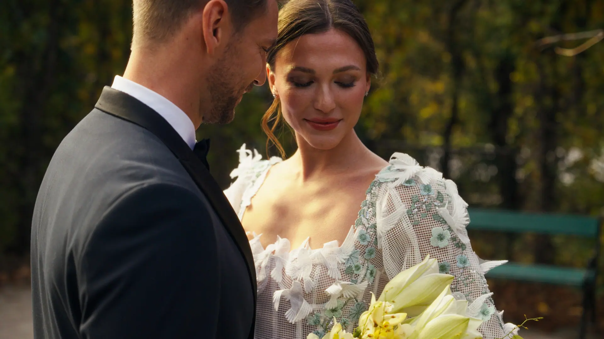 Bride and groom sharing a quiet portrait in warm light