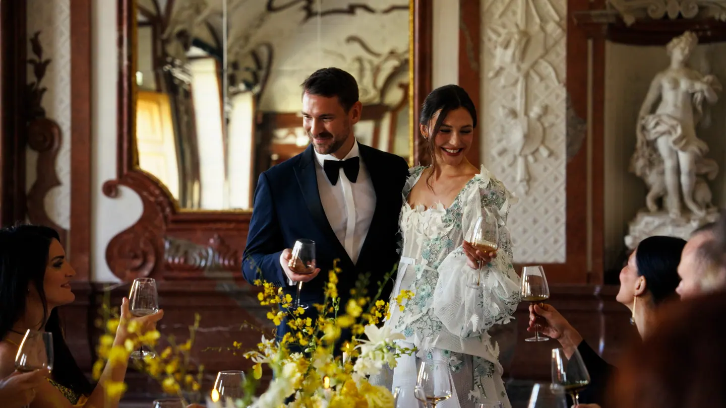 Bride and groom smiling during dinner in the Belvedere
