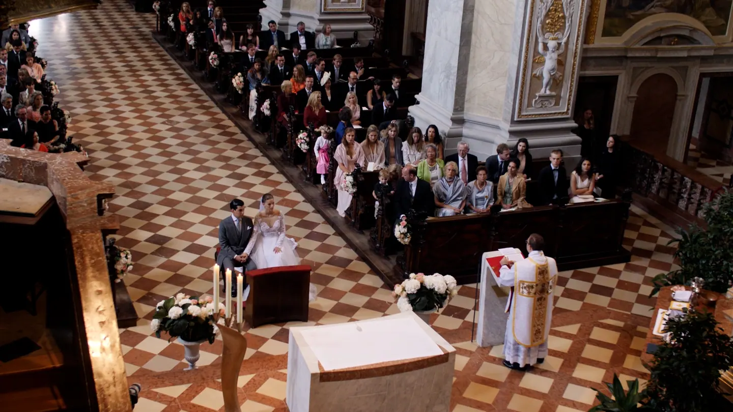 Bride and groom seated during their church ceremony