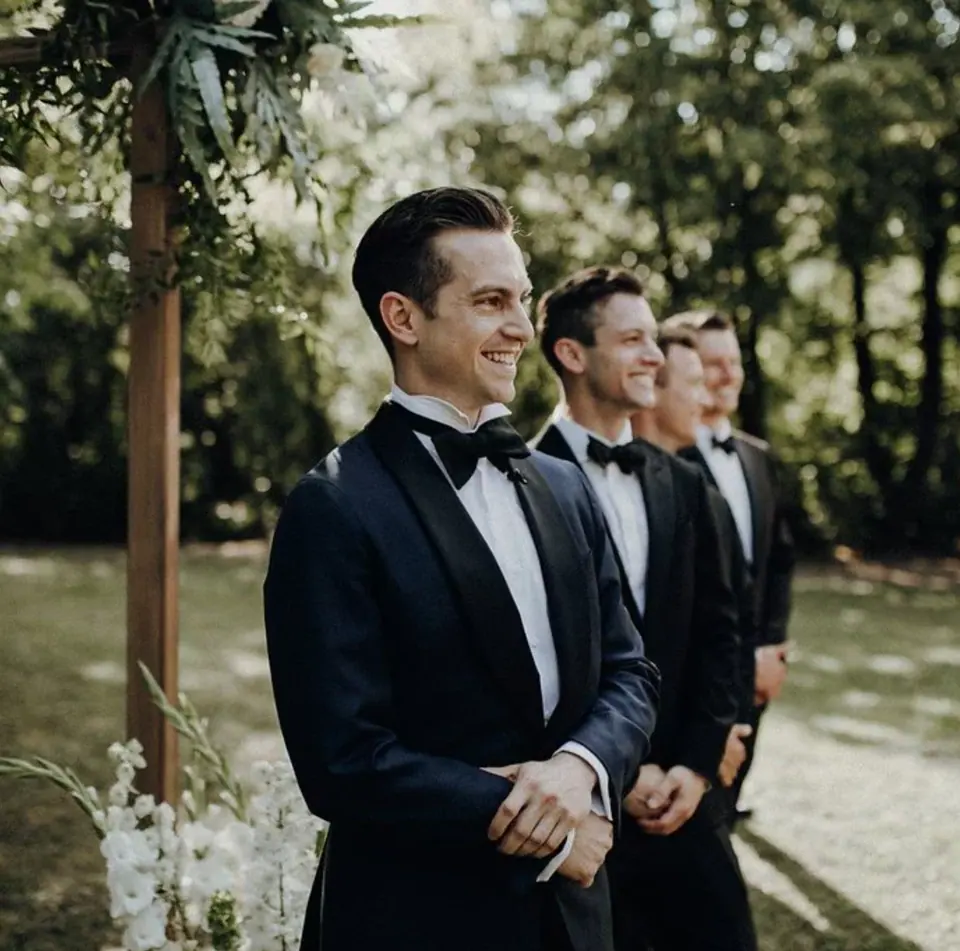 Groom smiling during the outdoor ceremony